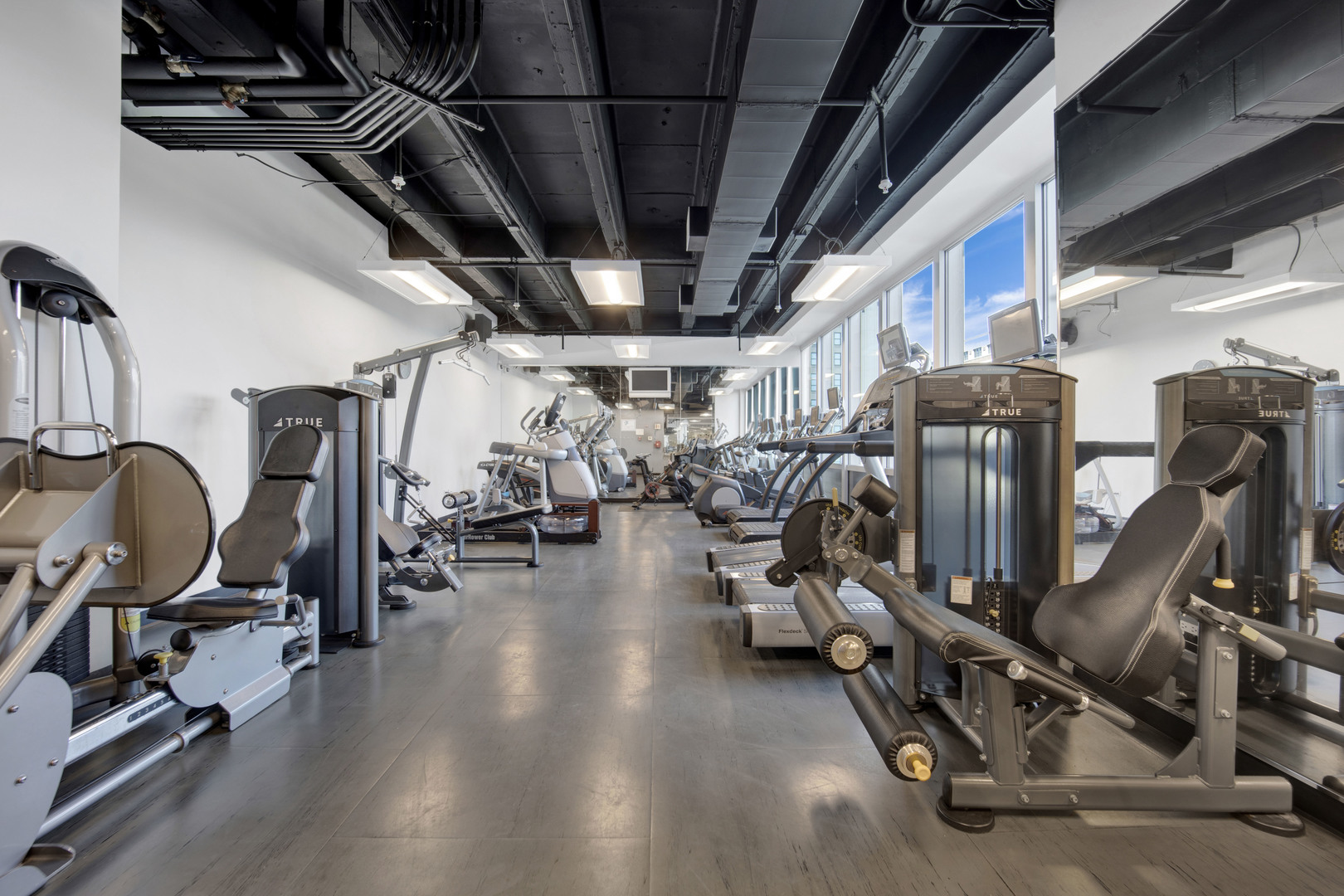 Undisclosed Address Chicago, IL 60654 - Photo 17 of 22 a view of a room with gym equipment