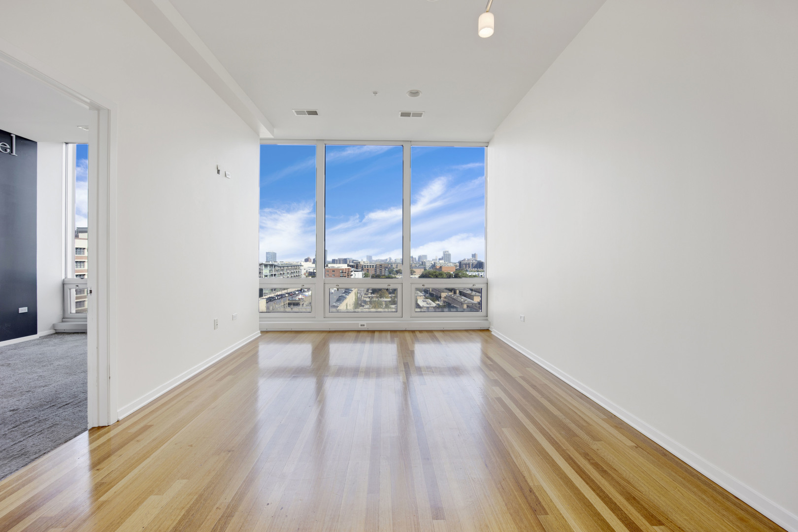Undisclosed Address Chicago, IL 60654 - Photo 5 of 22 a view of a livingroom with wooden floor