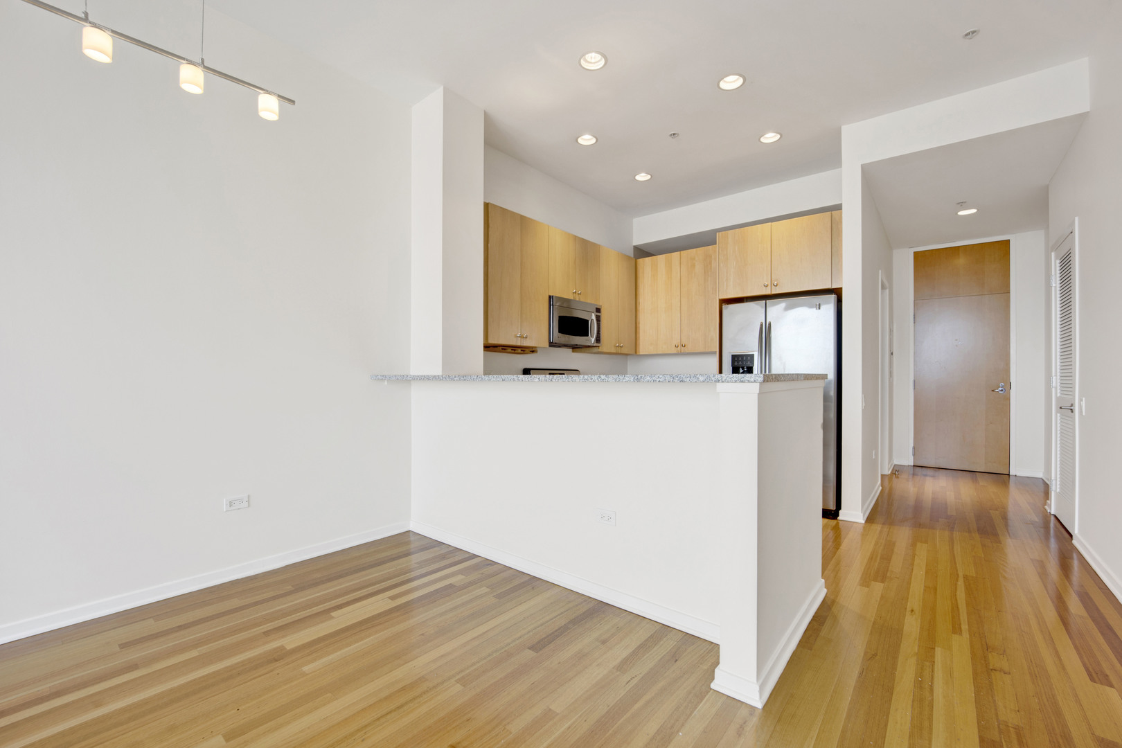 Undisclosed Address Chicago, IL 60654 - Photo 8 of 22 a view of a kitchen cabinets a sink and wooden floor