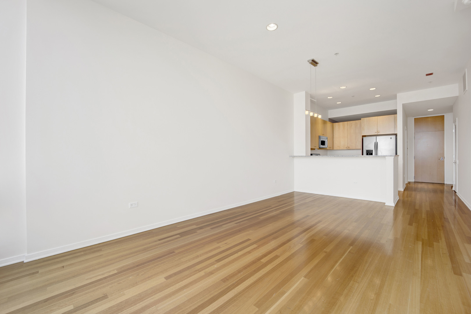 Undisclosed Address Chicago, IL 60654 - Photo 9 of 22 a view of empty room with wooden floor