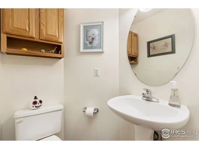 a bathroom with a sink a mirror and a toilet