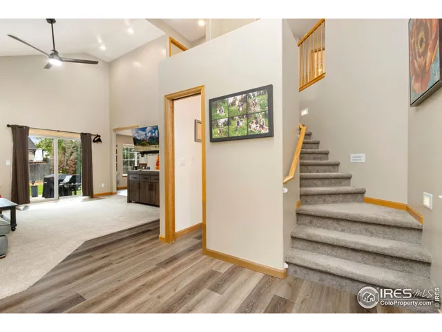 a view of an entryway with wooden floor