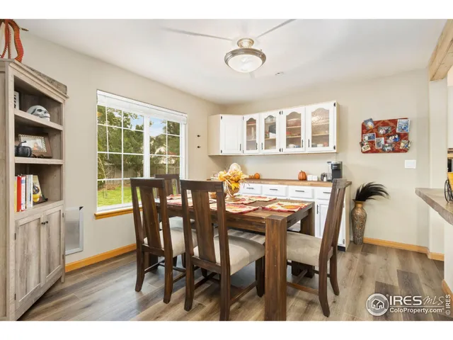 a view of a dining room with furniture and a potted plant