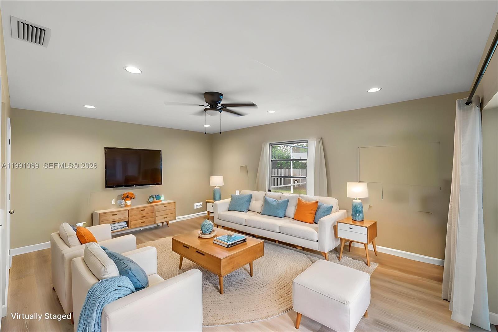 5171 Southwest 20th Street Plantation, FL 33317 - Photo 11 of 30 a living room with furniture and a flat screen tv