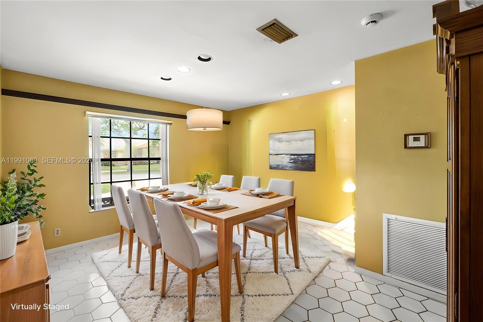 5171 Southwest 20th Street Plantation, FL 33317 - Photo 12 of 30 a view of a dining room with furniture and window