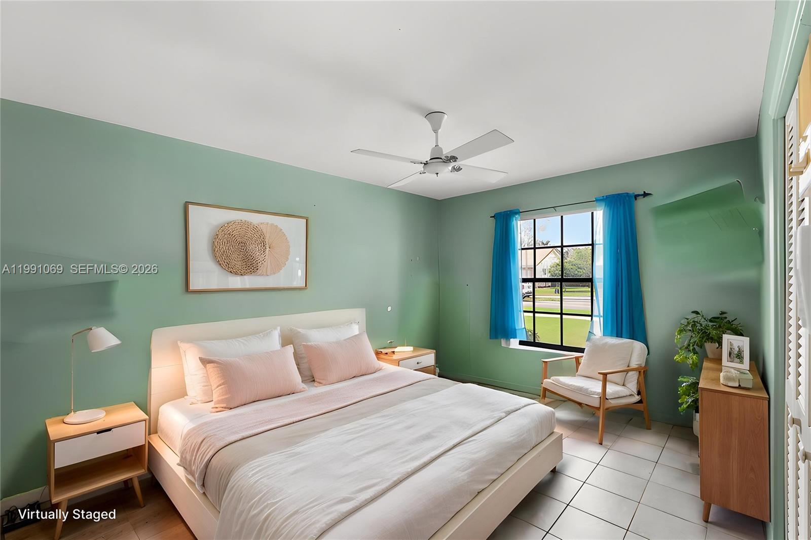 5171 Southwest 20th Street Plantation, FL 33317 - Photo 13 of 30 a bedroom with a bed and window