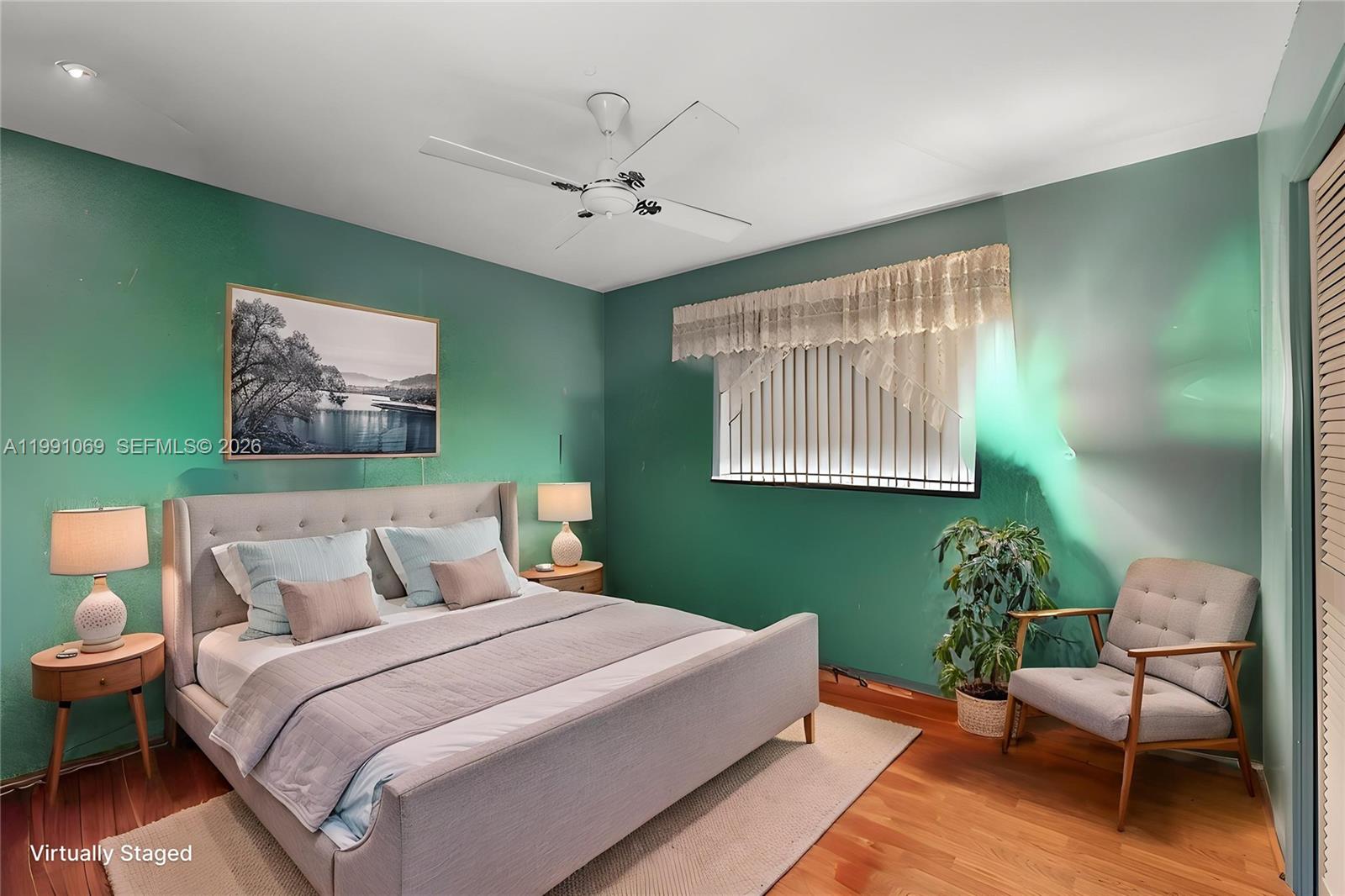 5171 Southwest 20th Street Plantation, FL 33317 - Photo 14 of 30 a bed room with a bed and a chair