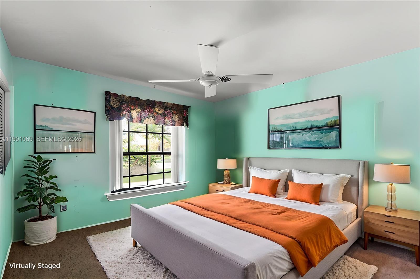 5171 Southwest 20th Street Plantation, FL 33317 - Photo 15 of 30 a bedroom with a bed and a window