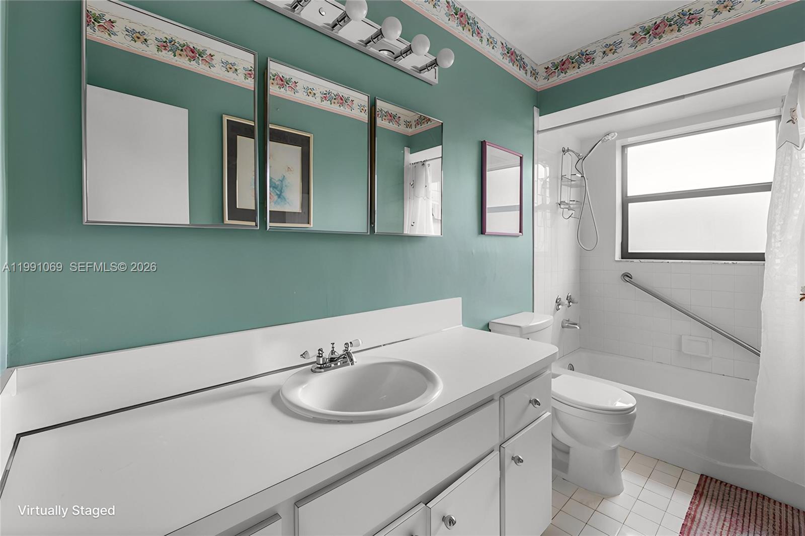 5171 Southwest 20th Street Plantation, FL 33317 - Photo 16 of 30 a bathroom with a sink and a mirror