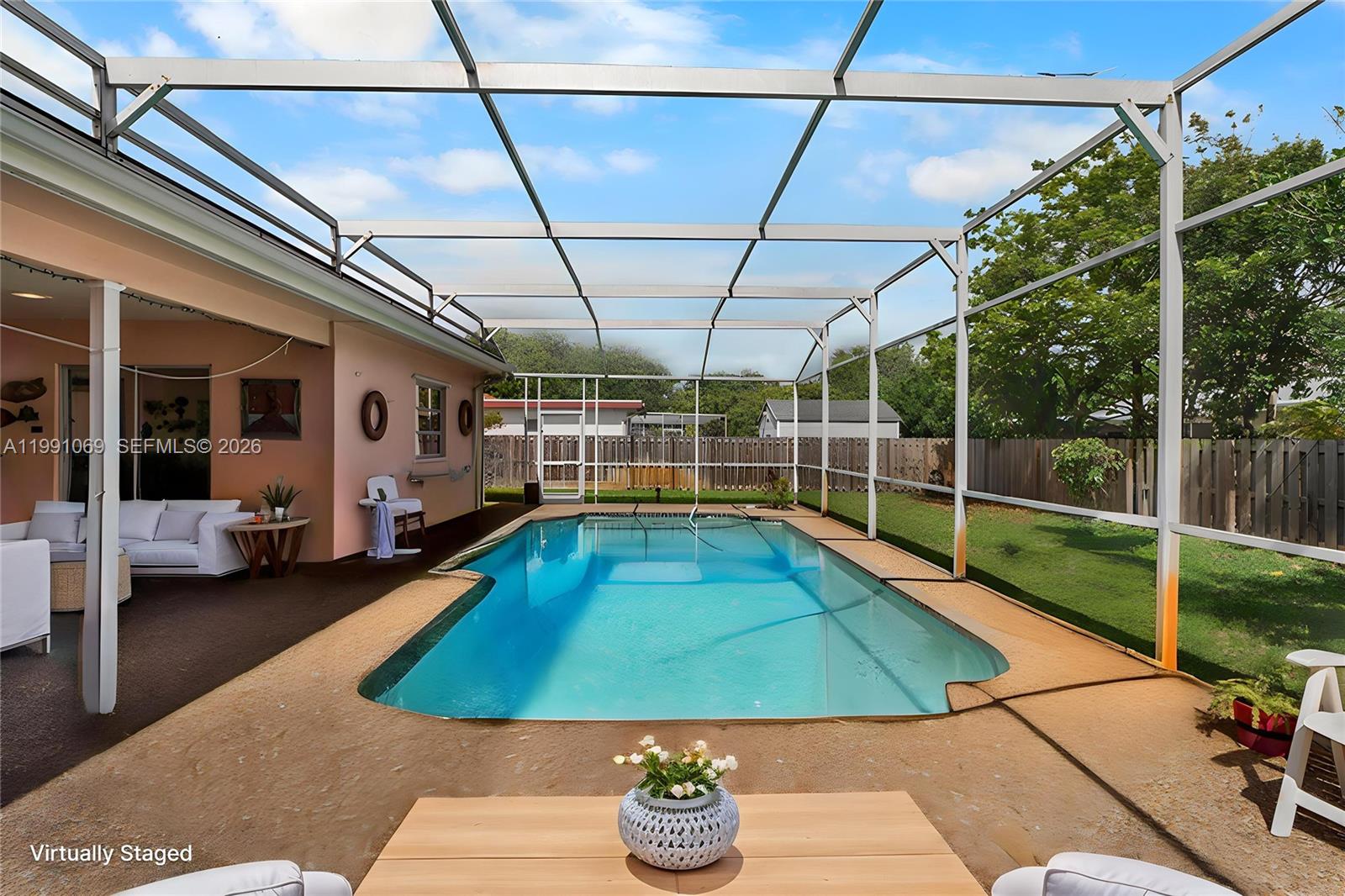 5171 Southwest 20th Street Plantation, FL 33317 - Photo 23 of 30 a view of a backyard with swimming pool