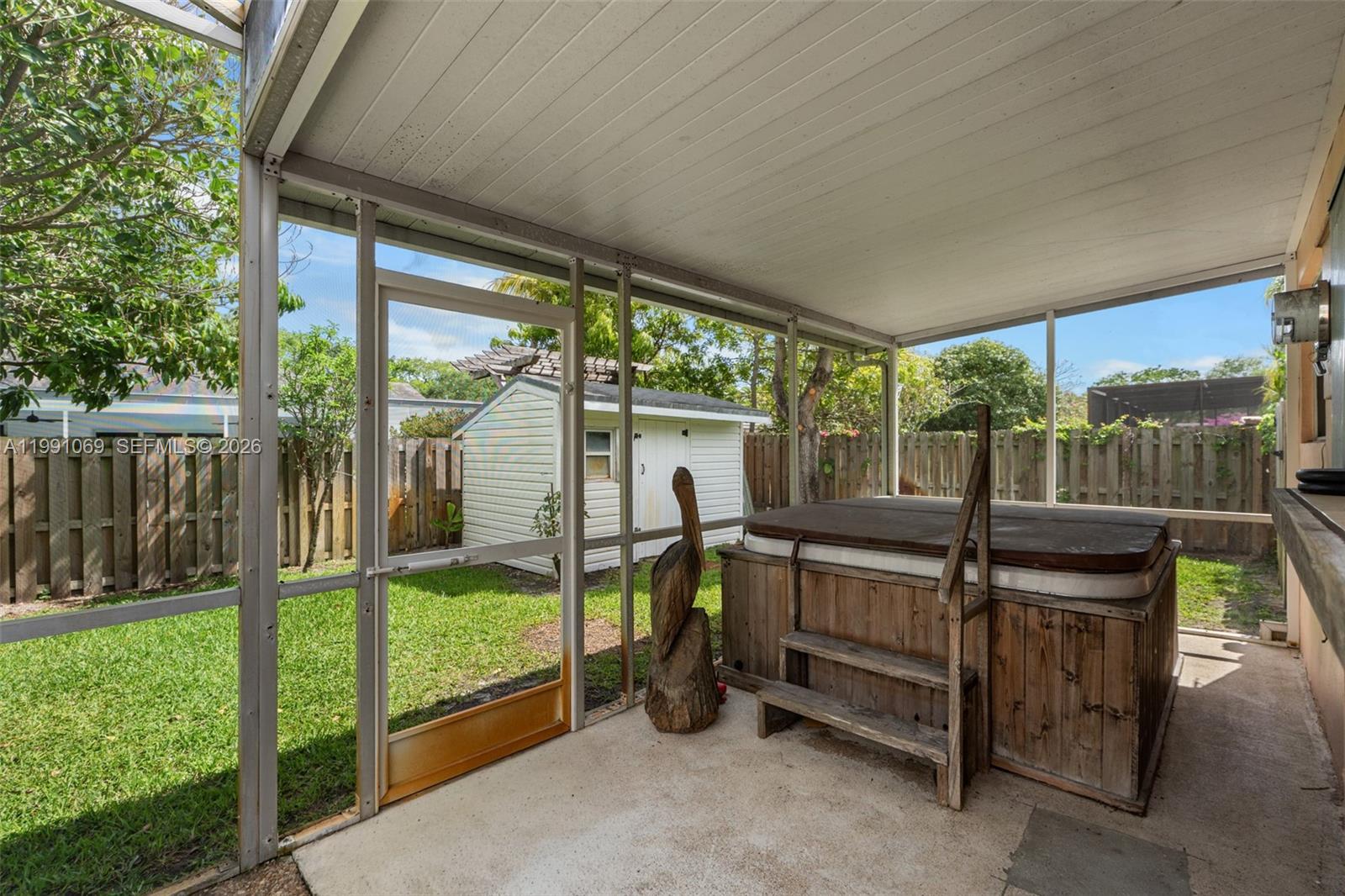 5171 Southwest 20th Street Plantation, FL 33317 - Photo 24 of 30 a view of a porch with furniture and garden