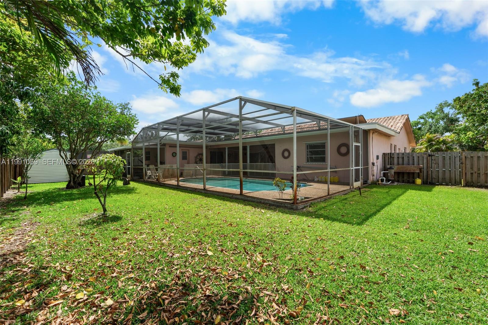 5171 Southwest 20th Street Plantation, FL 33317 - Photo 28 of 30 a view of a house with backyard porch and sitting area
