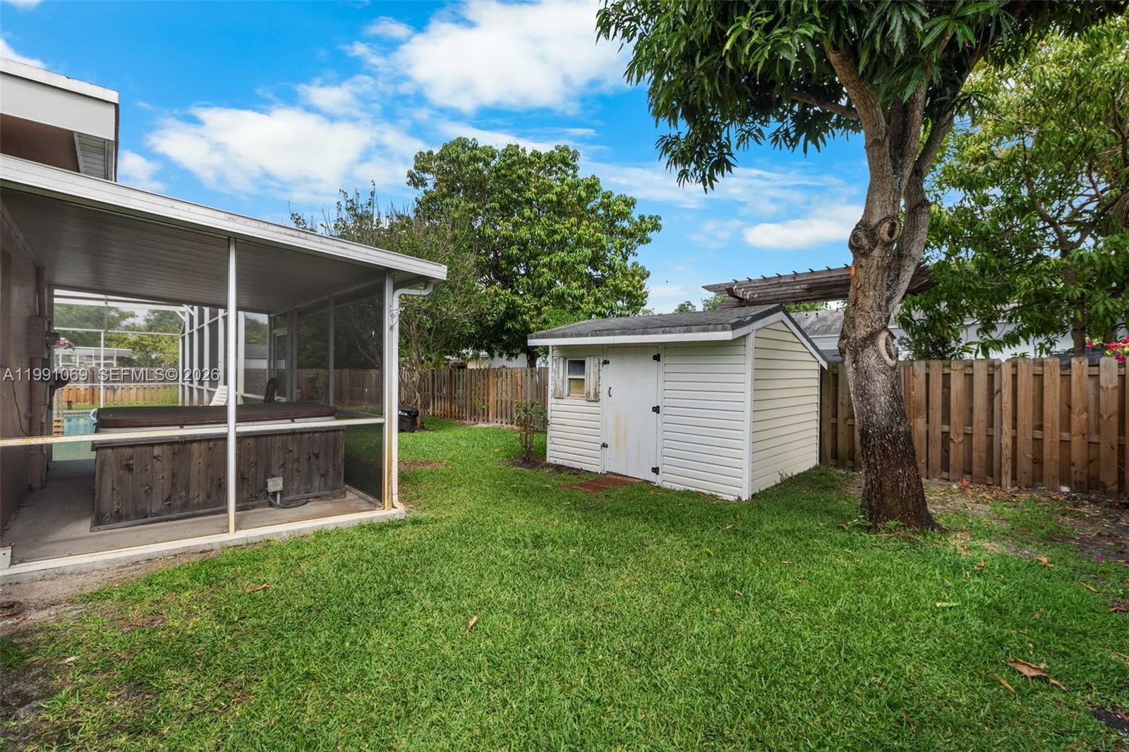 5171 Southwest 20th Street Plantation, FL 33317 - Photo 29 of 30 a view of a house with a yard and a large tree