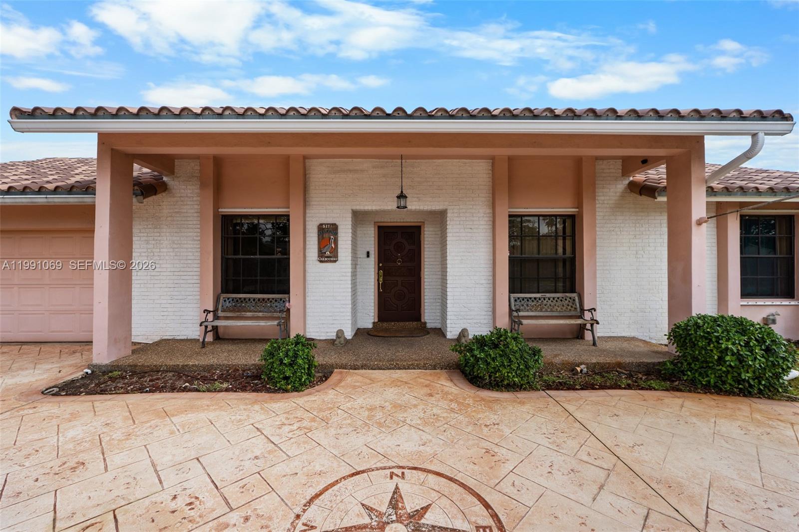 5171 Southwest 20th Street Plantation, FL 33317 - Photo 4 of 30 a front view of a house with a yard
