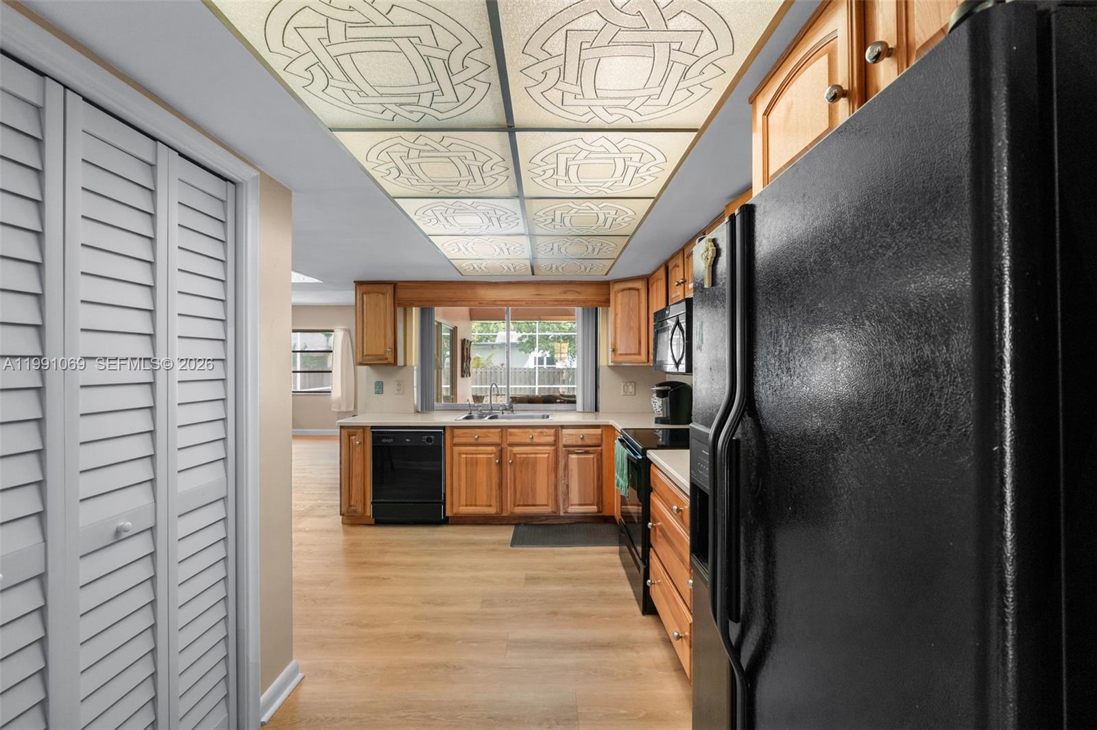 5171 Southwest 20th Street Plantation, FL 33317 - Photo 8 of 30 a kitchen with stainless steel appliances granite countertop a refrigerator and a sink