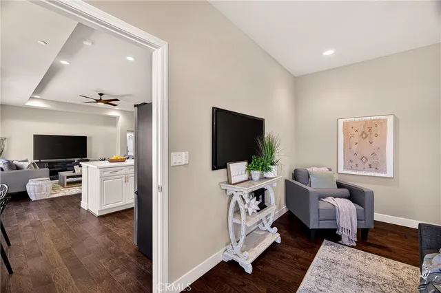 a view of bedroom and bedroom with wooden floor
