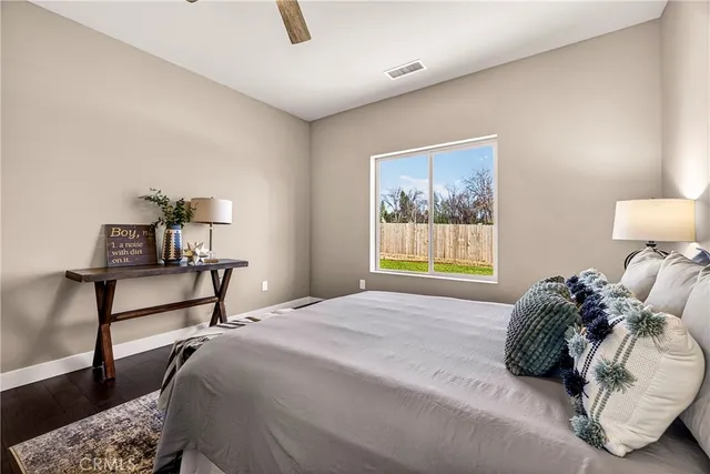 an aerial view of a house with a mountain