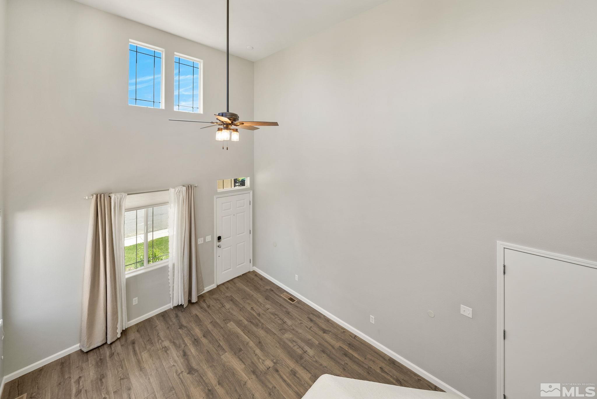 2270 Big Trail Circle Reno, NV 89521 - Photo 14 of 40 a view of an empty room with wooden floor and a window