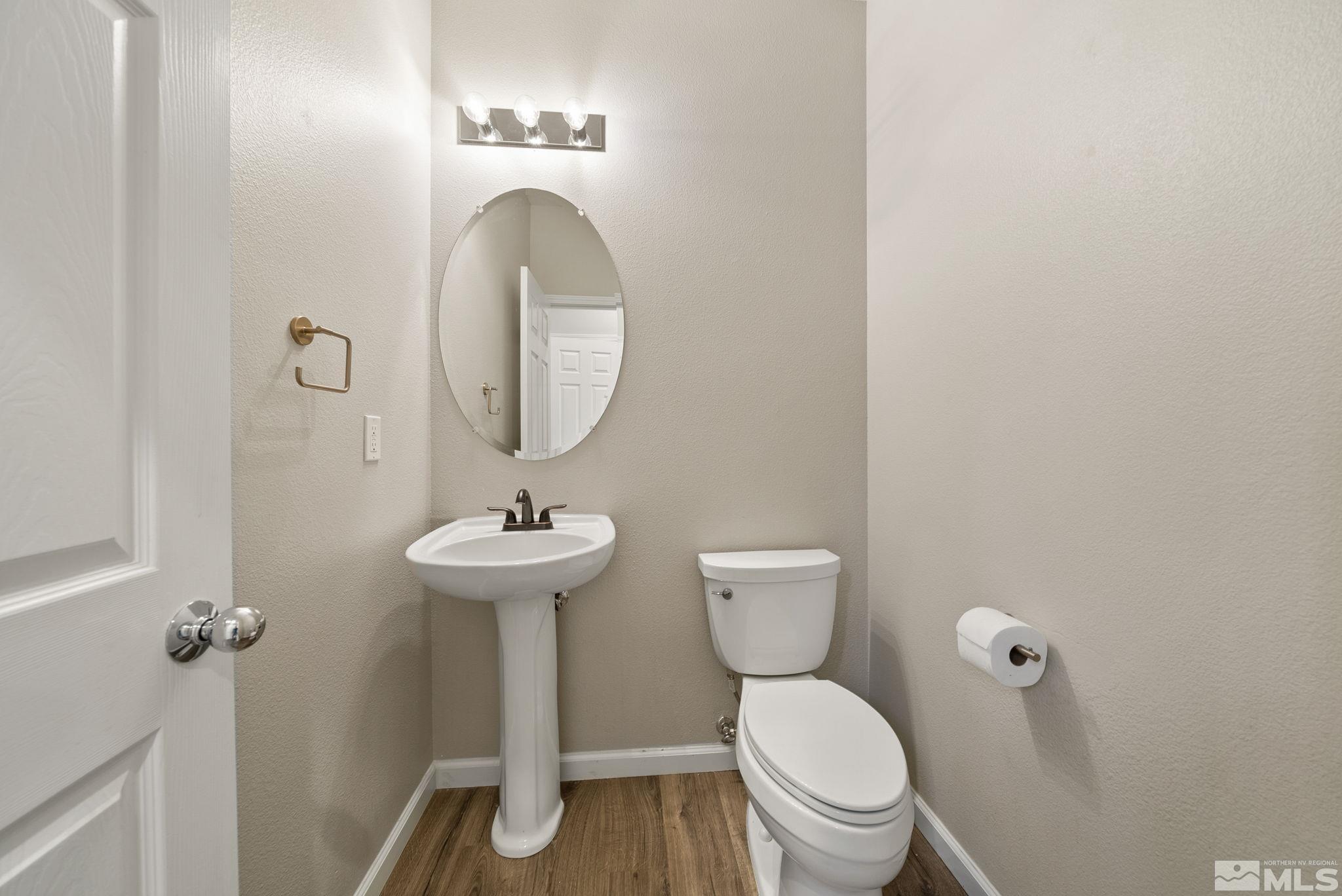 2270 Big Trail Circle Reno, NV 89521 - Photo 15 of 40 a bathroom with a toilet a sink and a mirror