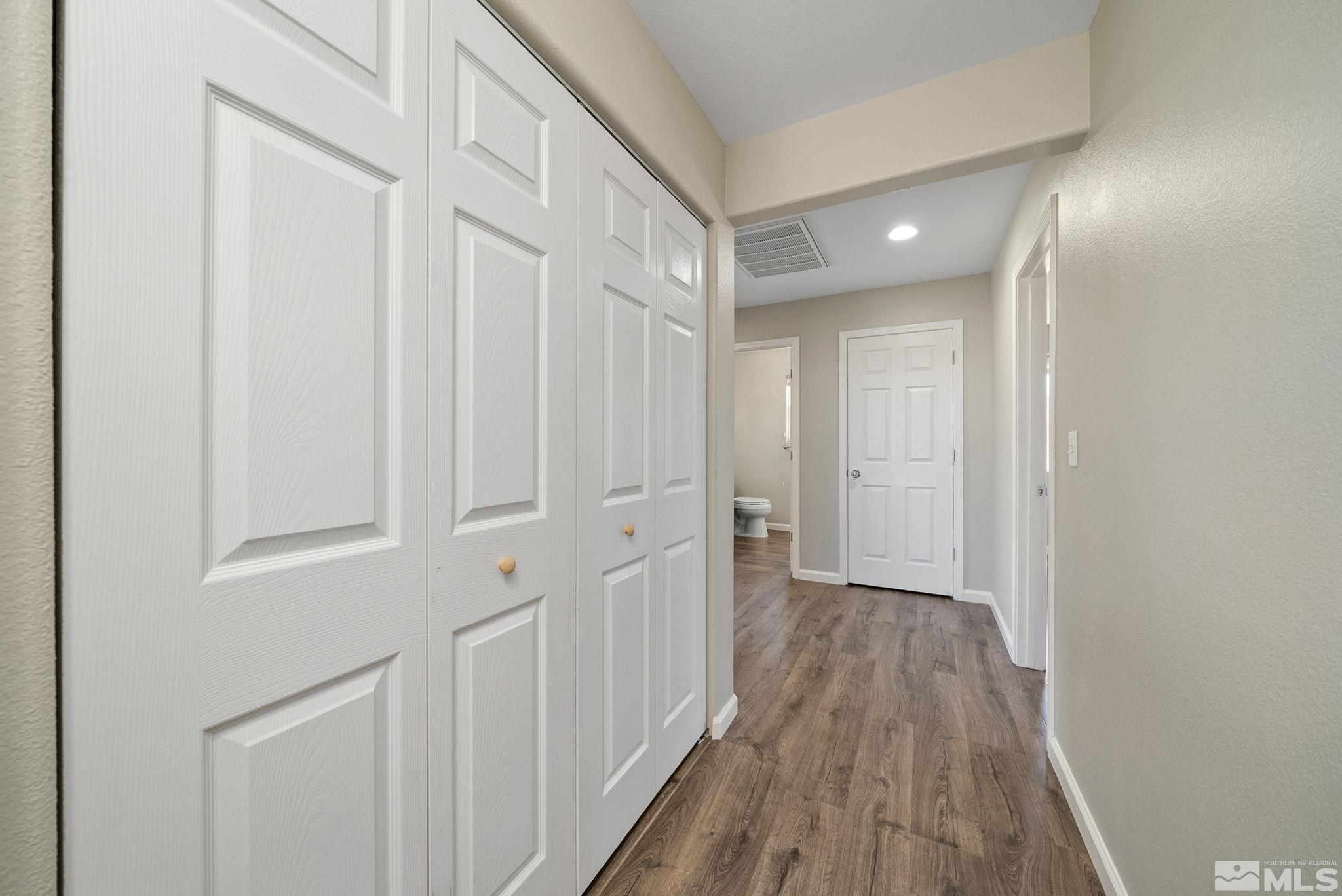 2270 Big Trail Circle Reno, NV 89521 - Photo 16 of 40 a view of a hallway with wooden floor
