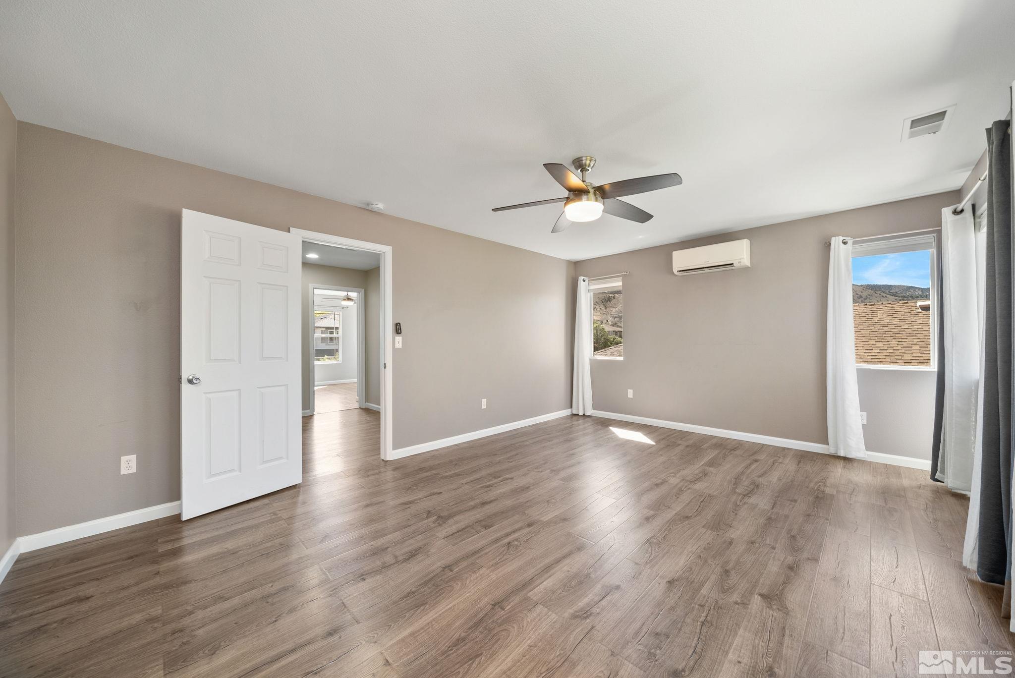 2270 Big Trail Circle Reno, NV 89521 - Photo 19 of 40 a view of an empty room with wooden floor