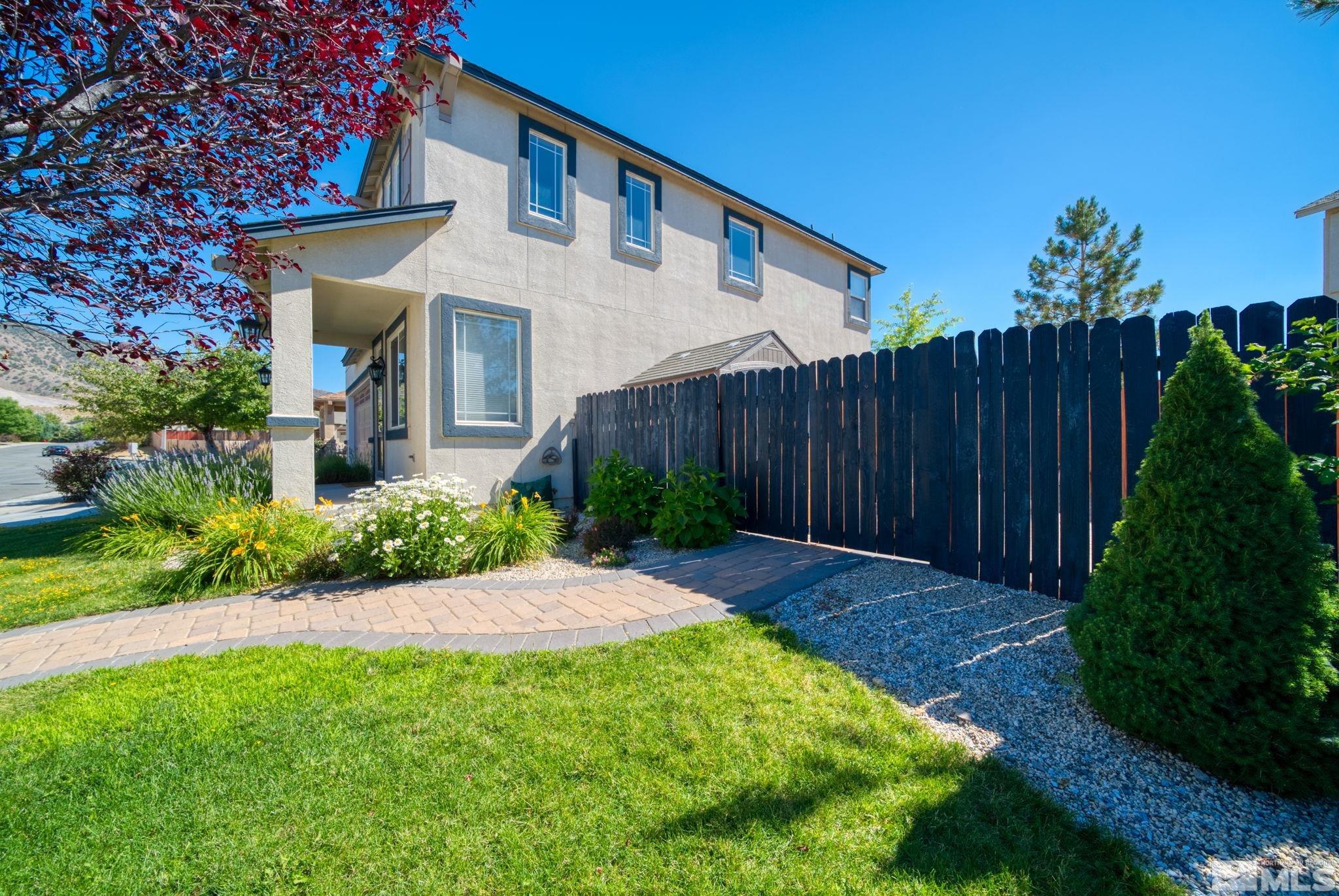 2270 Big Trail Circle Reno, NV 89521 - Photo 2 of 40 a front view of a house with garden