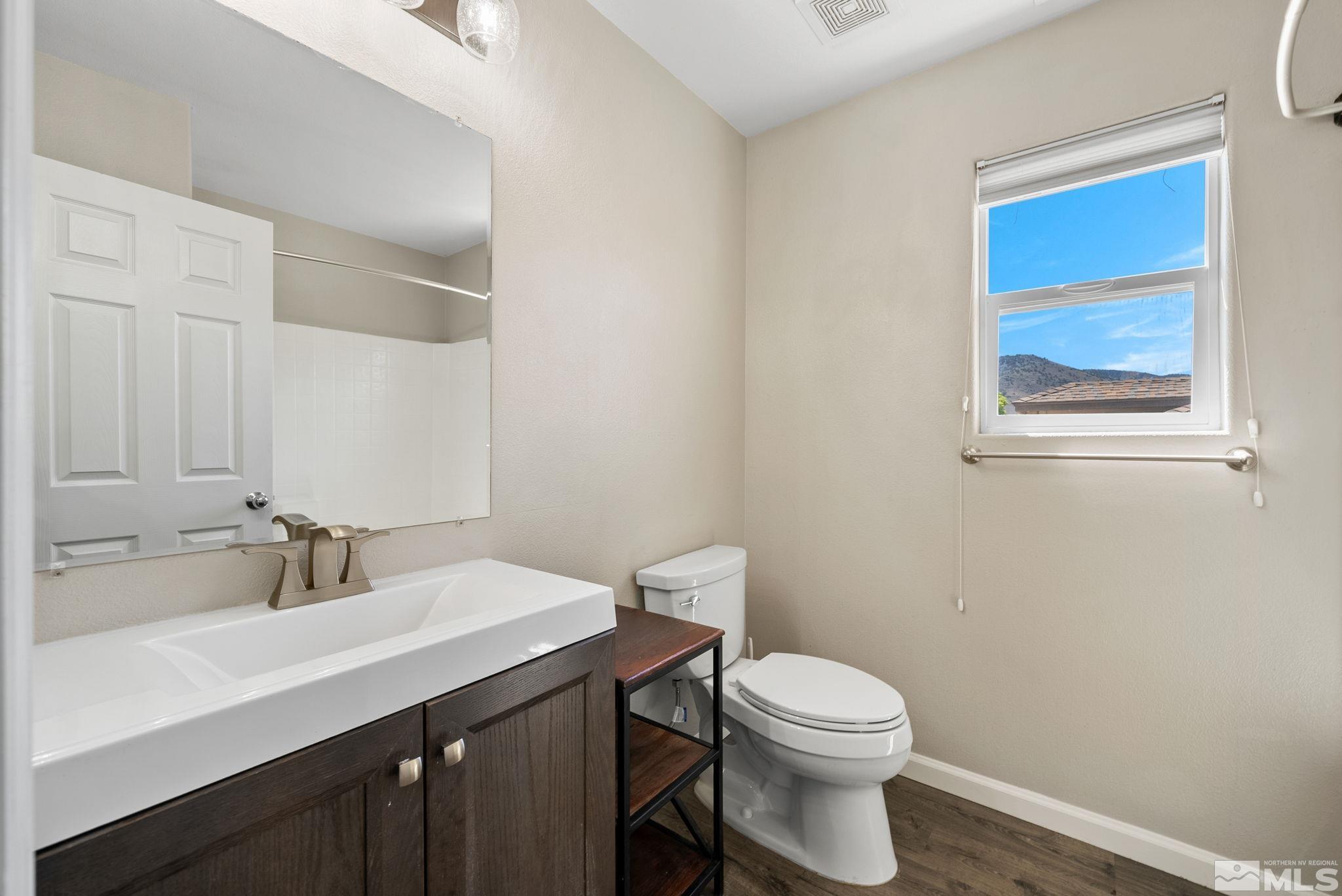 2270 Big Trail Circle Reno, NV 89521 - Photo 25 of 40 a bathroom with a sink a toilet and mirror