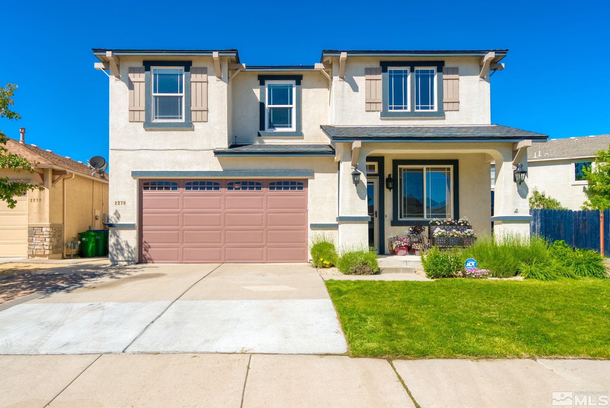2270 Big Trail Circle Reno, NV 89521 - Photo 3 of 40 a front view of a house with garden