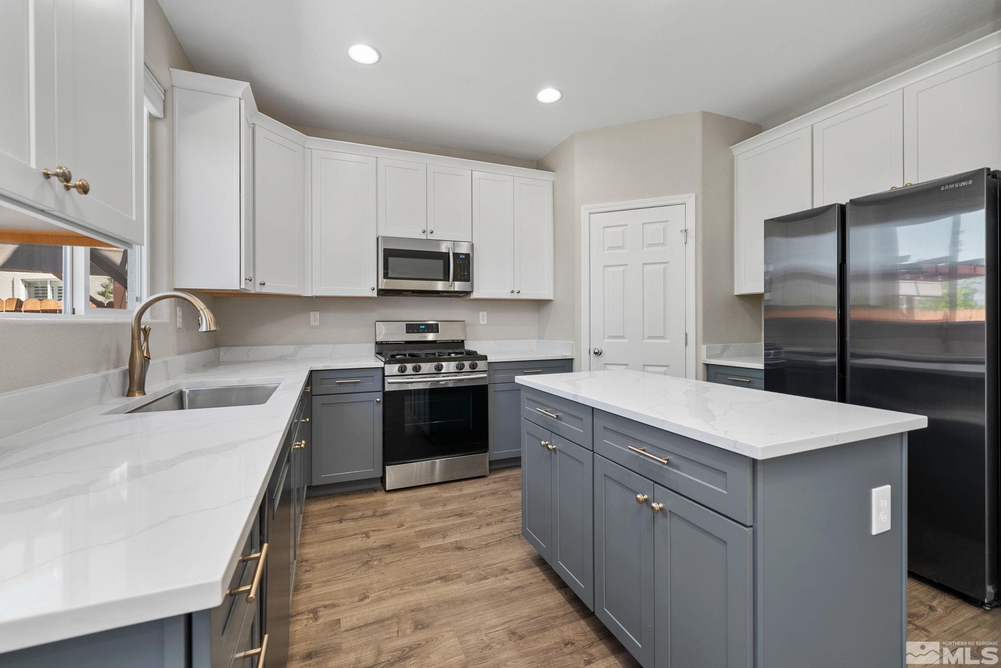 2270 Big Trail Circle Reno, NV 89521 - Photo 7 of 40 a kitchen with a sink stove top oven and refrigerator