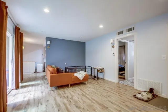 a bedroom with furniture and window