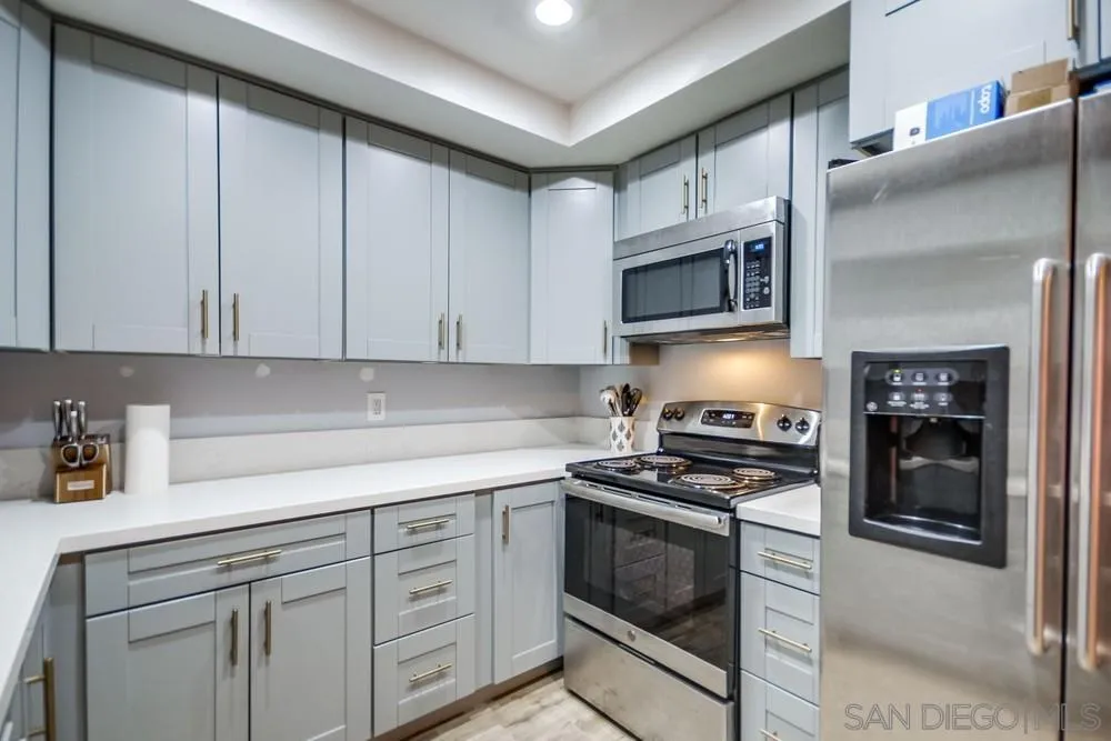 294 Chambers Street, Unit 45 El Cajon, CA 92020 - Photo 6 of 38 a kitchen with cabinets stainless steel appliances and cabinets