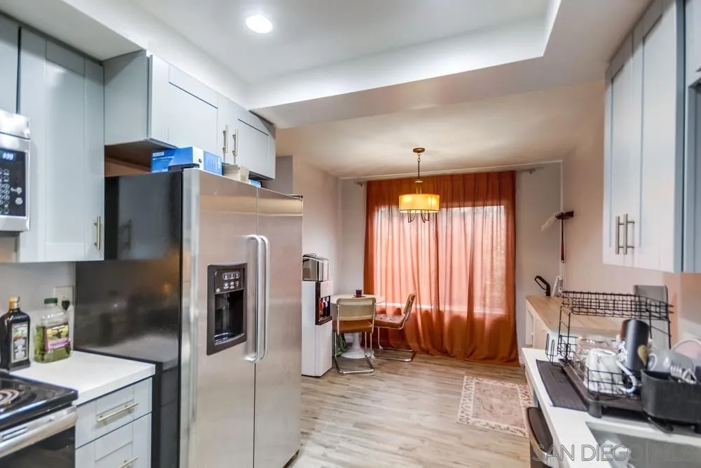 294 Chambers Street, Unit 45 El Cajon, CA 92020 - Photo 7 of 38 a kitchen with stainless steel appliances granite countertop a refrigerator and a stove top oven