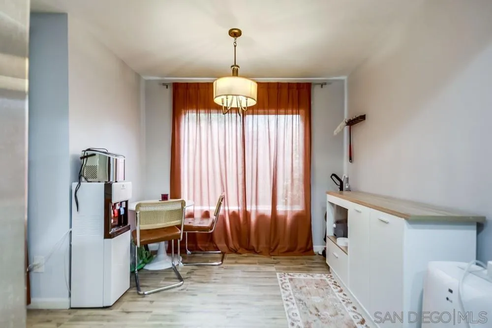 294 Chambers Street, Unit 45 El Cajon, CA 92020 - Photo 8 of 38 a dining room with furniture and a chandelier