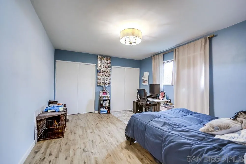 294 Chambers Street, Unit 45 El Cajon, CA 92020 - Photo 10 of 38 a bedroom with a bed and a chandelier