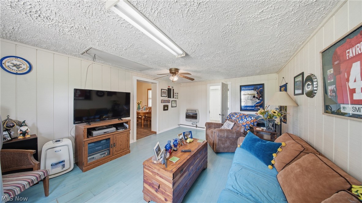 89 Dagg Road Parkersburg, WV 26101 - Photo 23 of 45 Interior room featuring white vertical paneling and a textured white ceiling