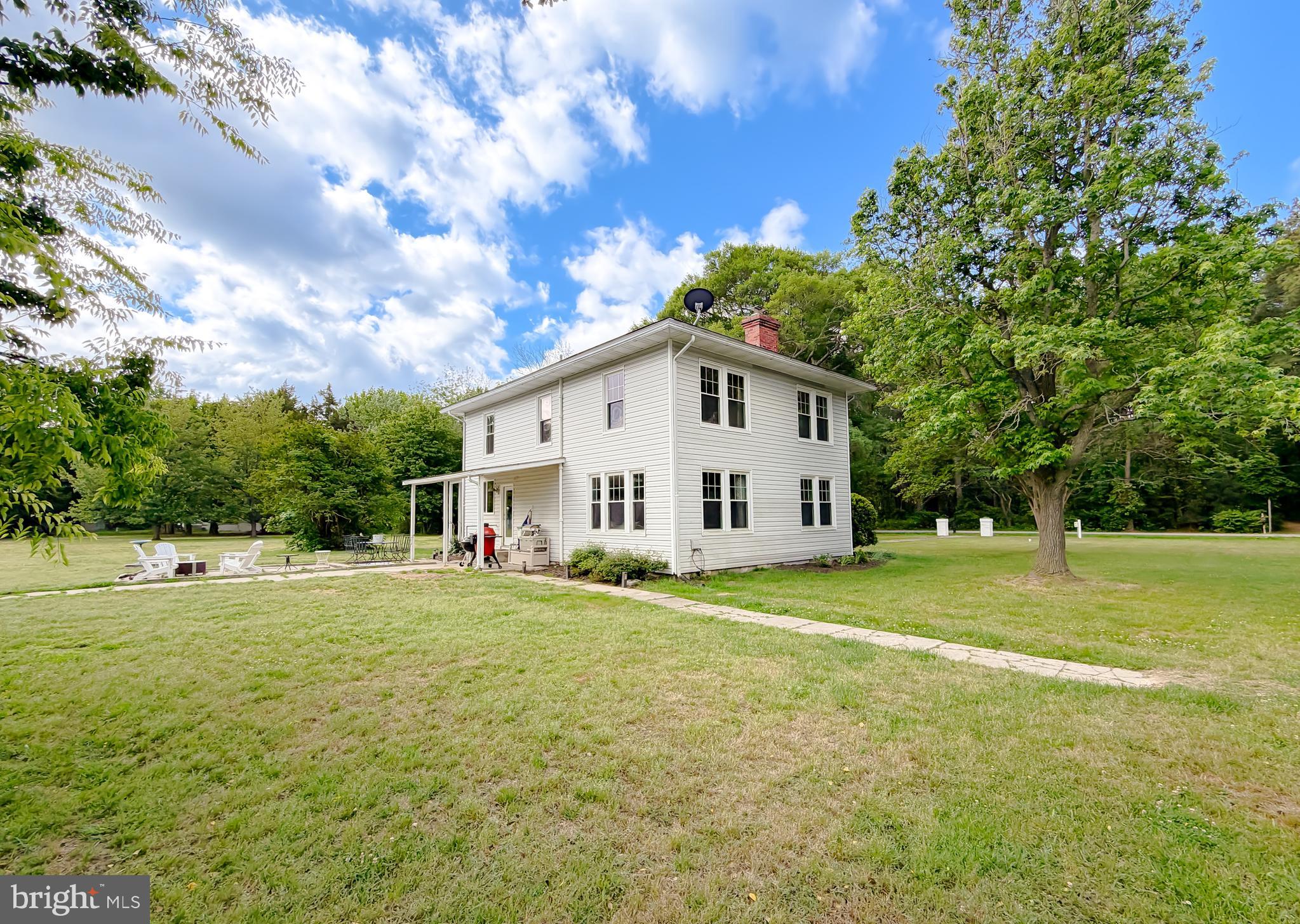 16146 Thomas Road Piney Point, MD 20674 - Photo 40 of 57 a view of a house with a big yard and a large tree