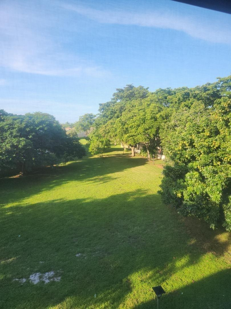 613 South State Road 7, Unit 3E Pompano Beach, FL 33068 - Photo 4 of 15 a view of an ocean from a yard