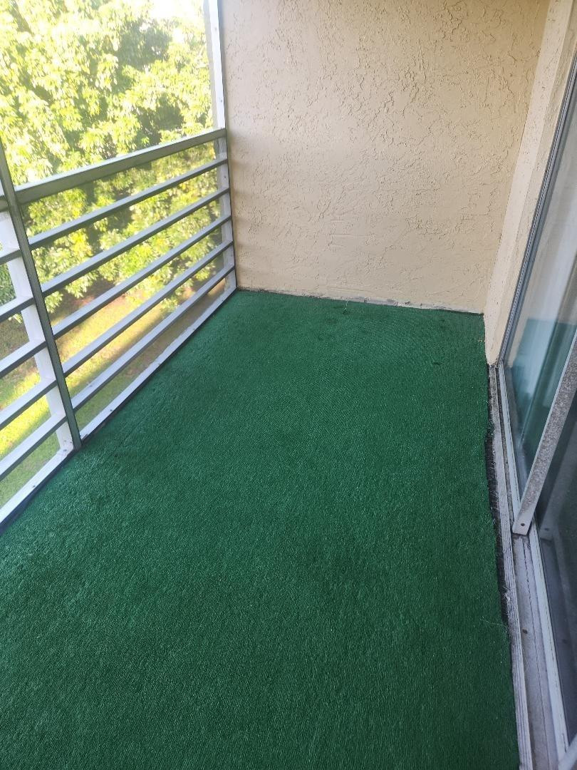 613 South State Road 7, Unit 3E Pompano Beach, FL 33068 - Photo 5 of 15 a view of a backyard with a garden