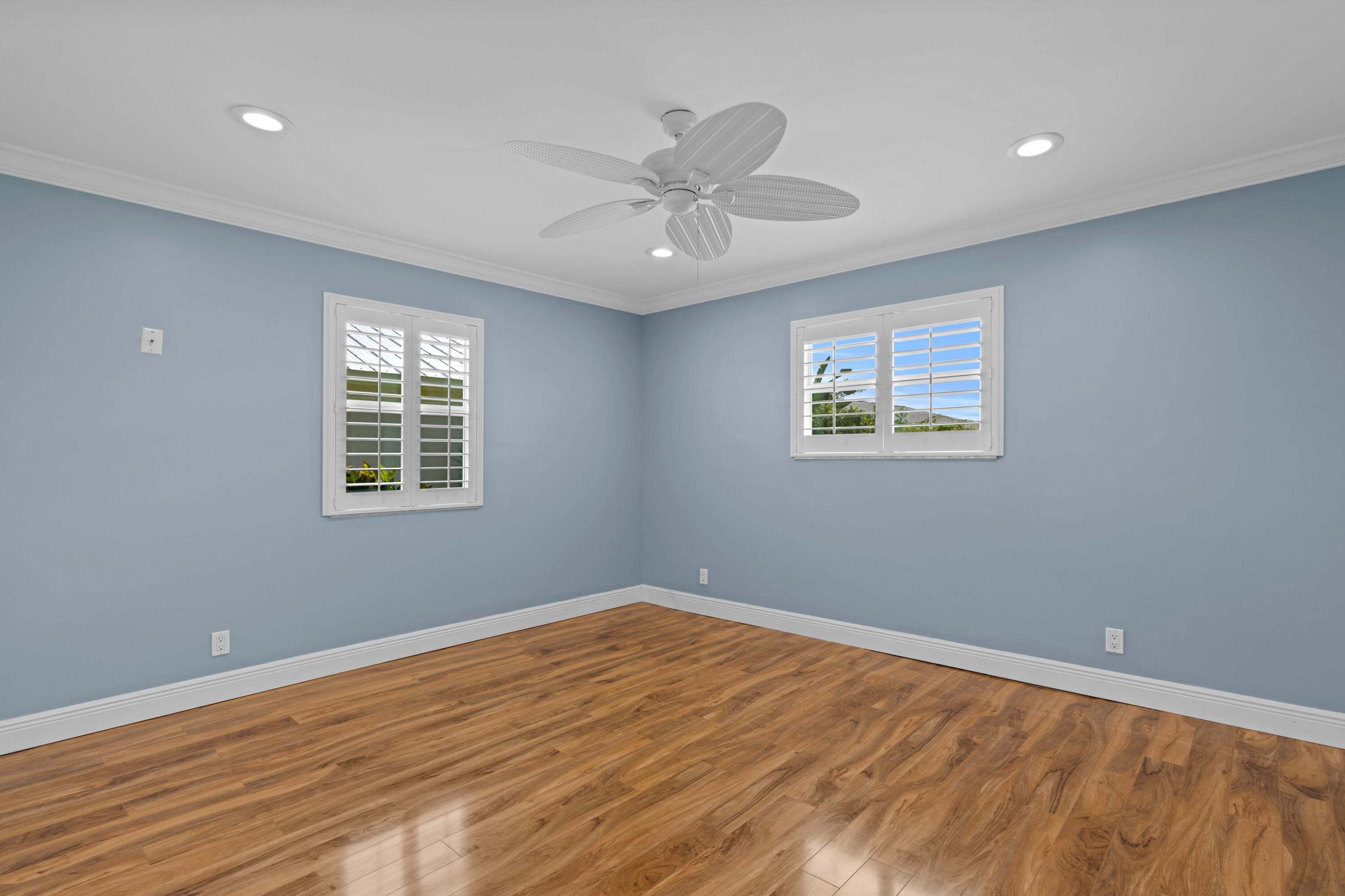 18312 Southeast Eagle Lane Jupiter, FL 33469 - Photo 14 of 17 a view of an empty room with wooden floor and a window