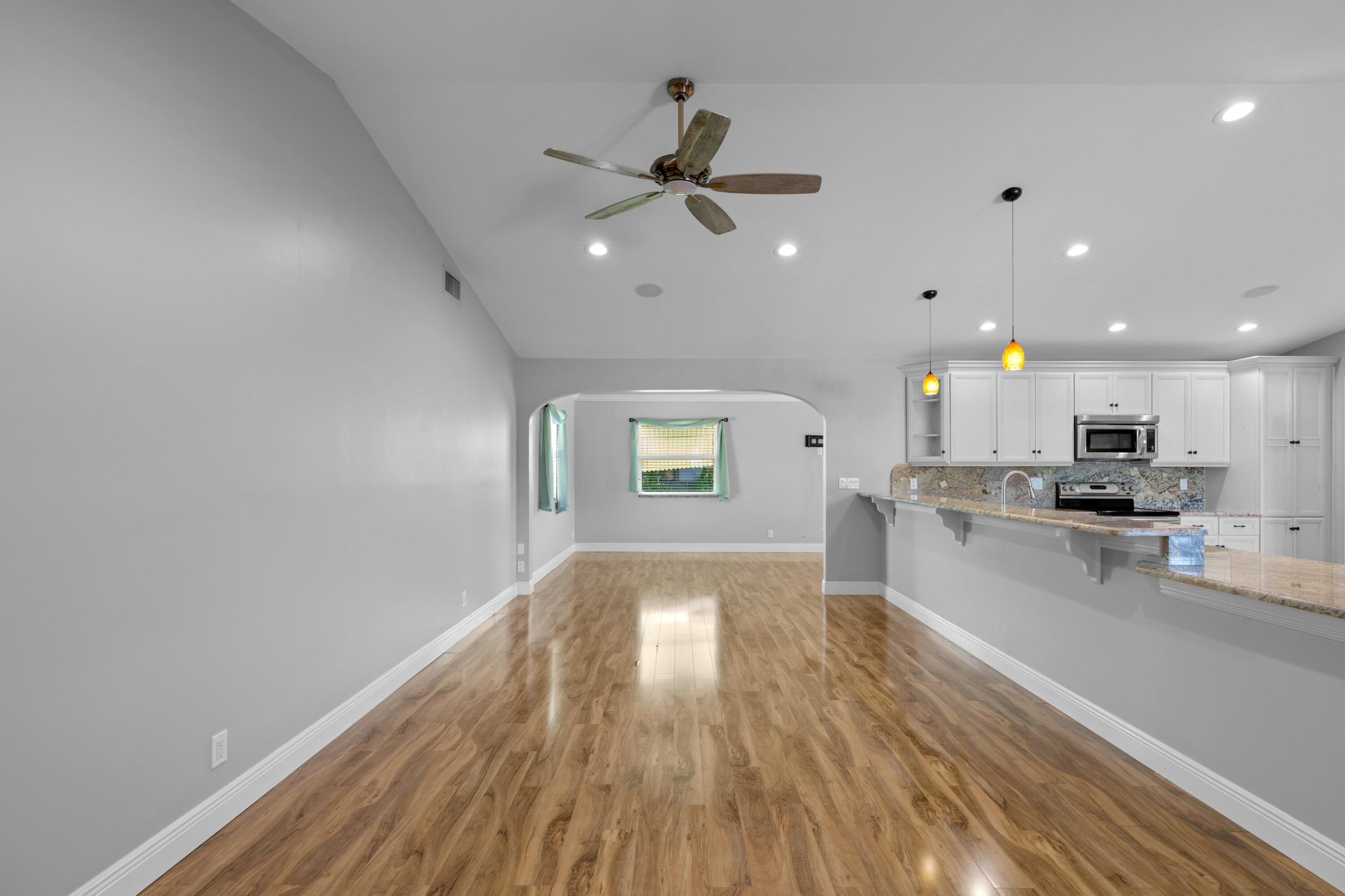 18312 Southeast Eagle Lane Jupiter, FL 33469 - Photo 7 of 17 a view of kitchen with sink microwave and stove