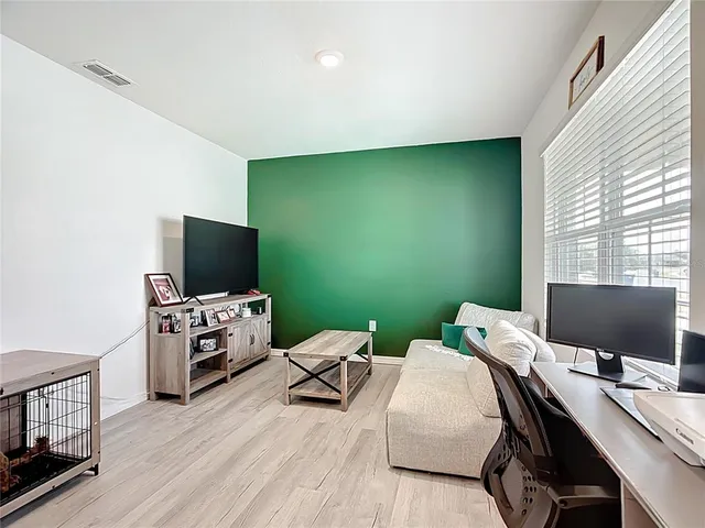 a living room with furniture and window