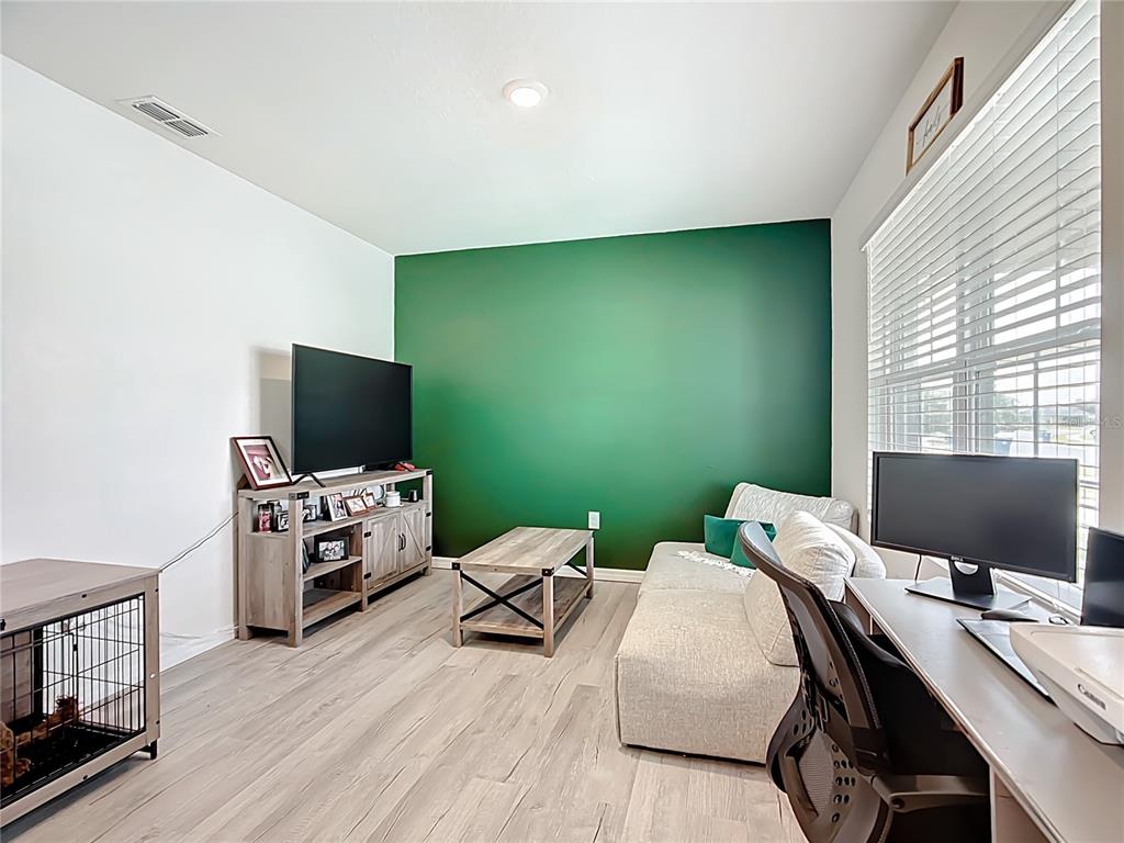 605 Honey Bell Road Winter Haven, FL 33880 - Photo 11 of 71 a workspace with furniture and window