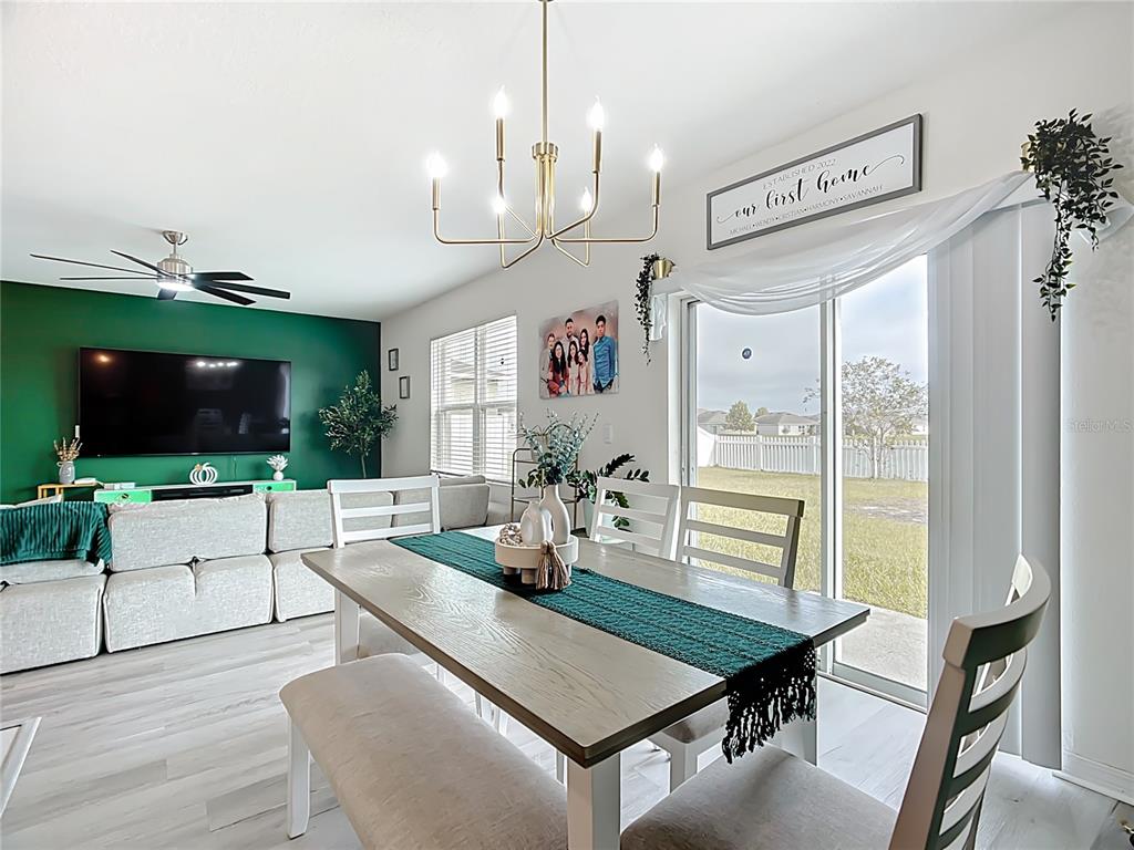 605 Honey Bell Road Winter Haven, FL 33880 - Photo 22 of 71 a room with furniture and a flat screen tv