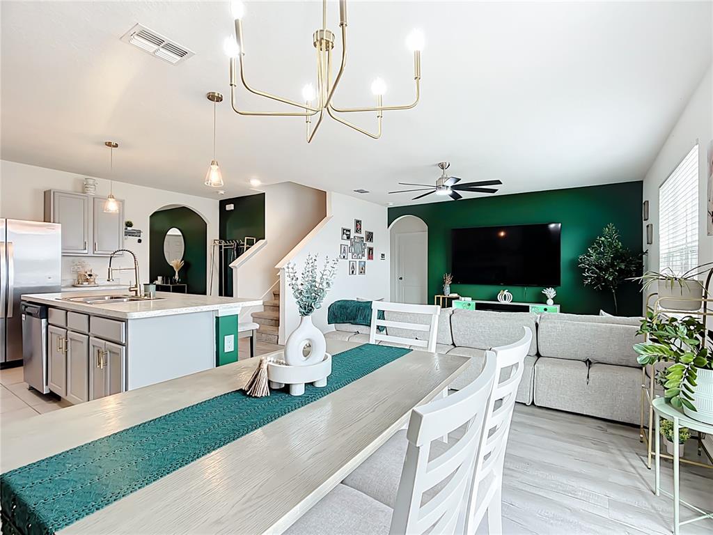 605 Honey Bell Road Winter Haven, FL 33880 - Photo 23 of 71 a living room with furniture and a flat screen tv