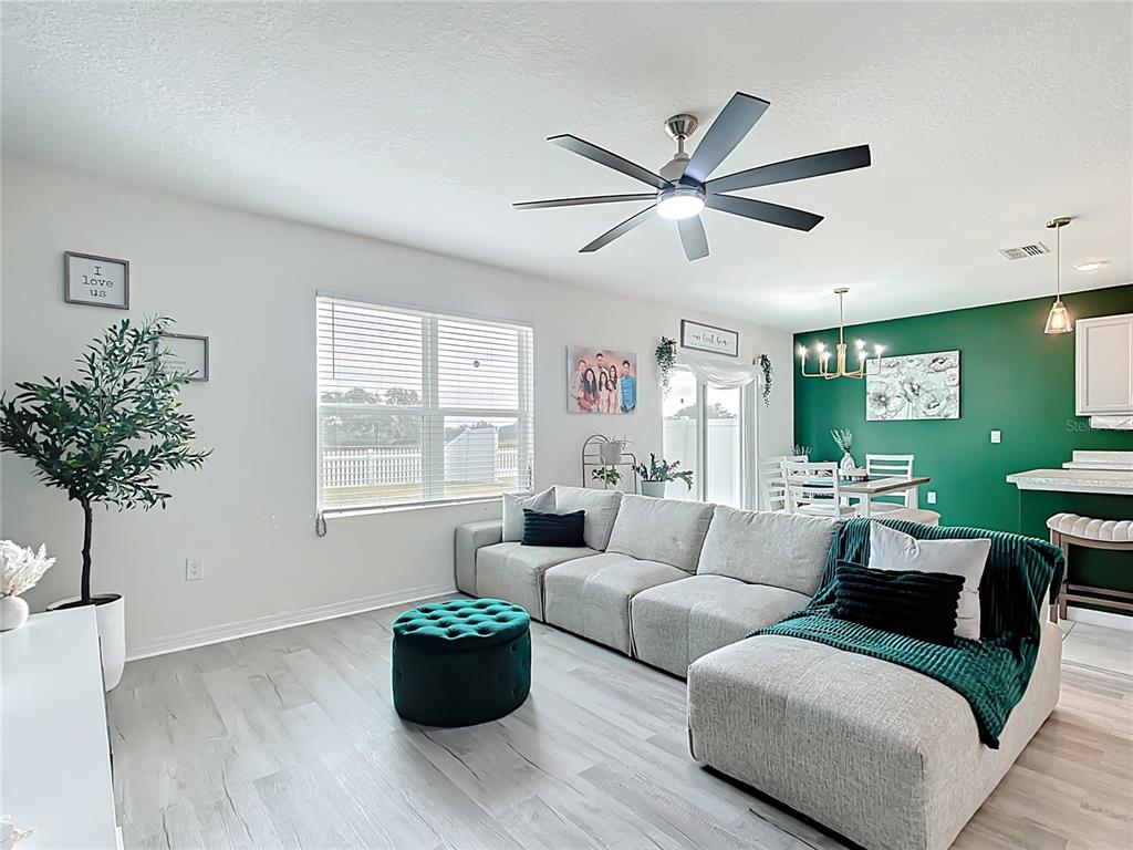 605 Honey Bell Road Winter Haven, FL 33880 - Photo 29 of 71 a living room with furniture or window and a potted plant