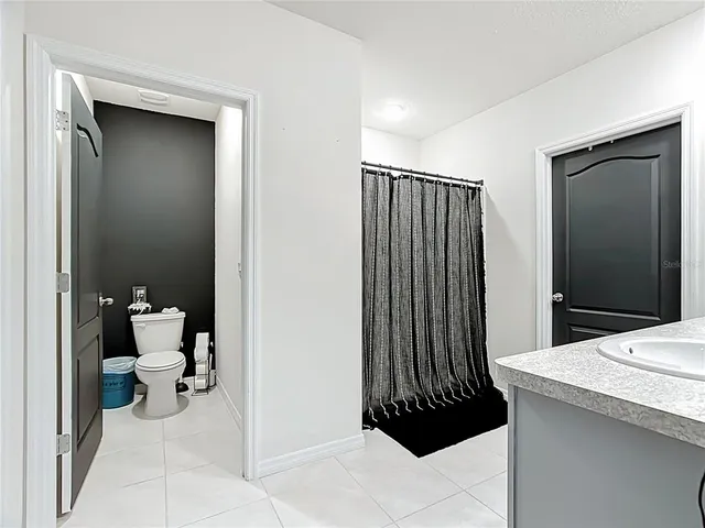 a bedroom with a bed and a table in it