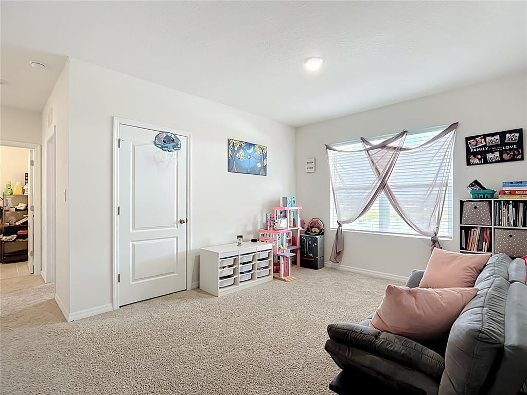 605 Honey Bell Road Winter Haven, FL 33880 - Photo 44 of 71 a livingroom with furniture and a window