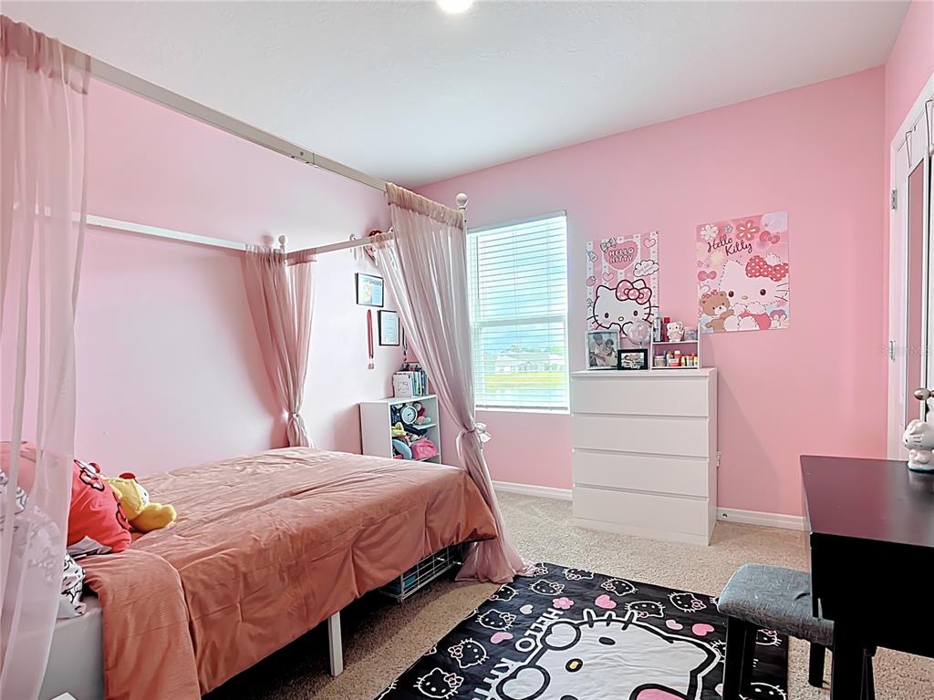 605 Honey Bell Road Winter Haven, FL 33880 - Photo 50 of 71 a bedroom with a bed and a window