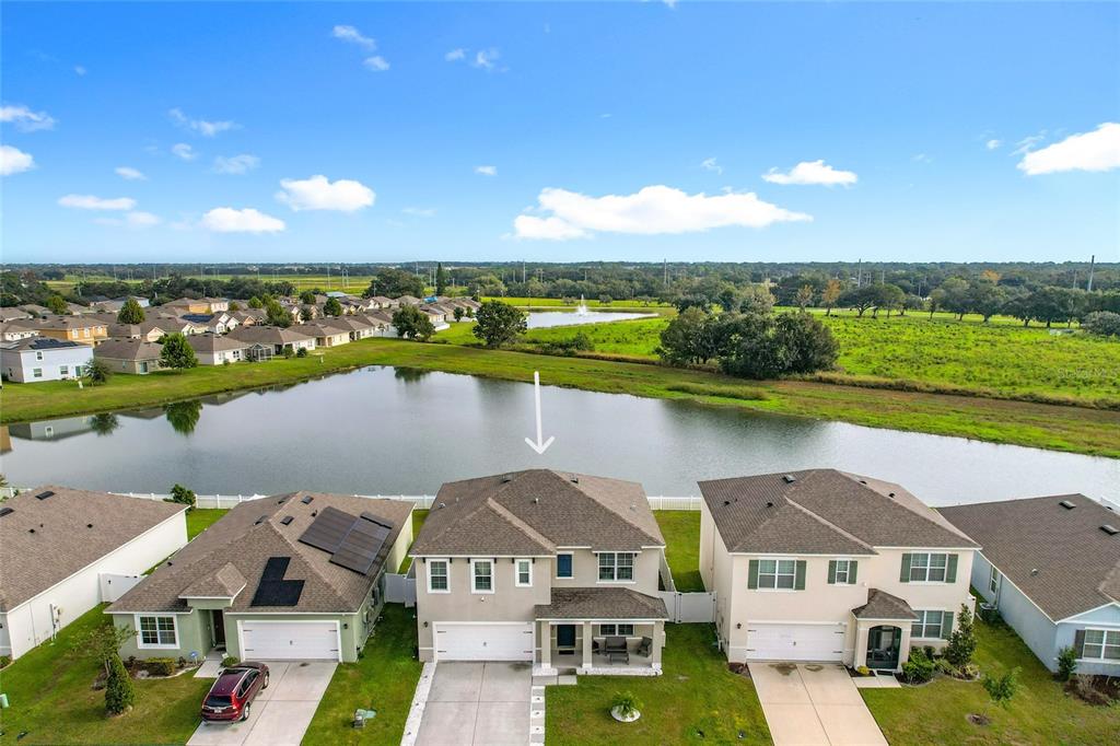 605 Honey Bell Road Winter Haven, FL 33880 - Photo 5 of 71 an aerial view of a house with a lake view