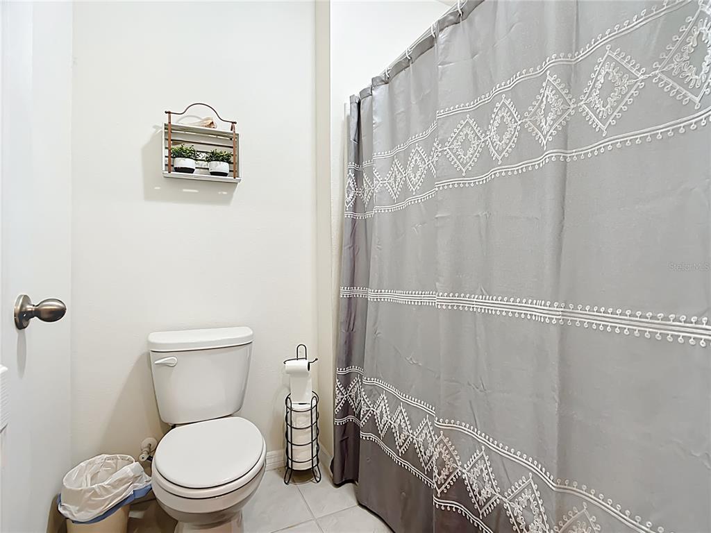 605 Honey Bell Road Winter Haven, FL 33880 - Photo 54 of 71 a bathroom with a toilet a sink and shower